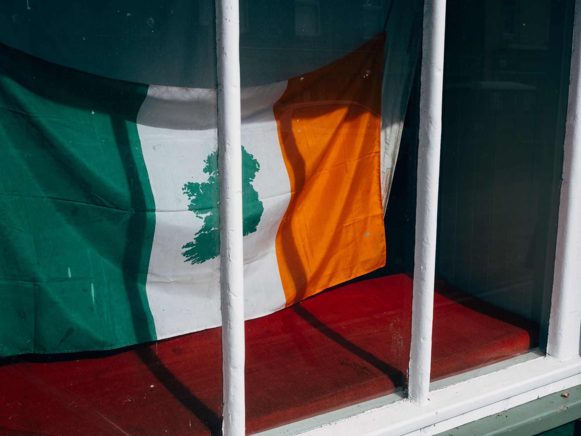 Irish flag behind bars